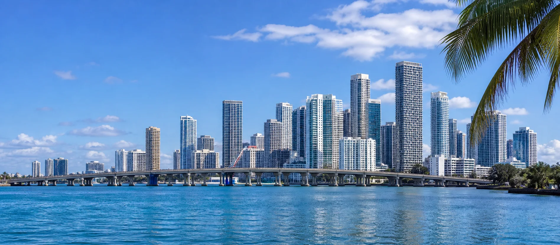 Miami skyline across the water in daylight.
